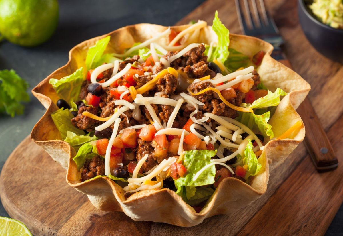 Taco salad served in a bowl of tortilla chips