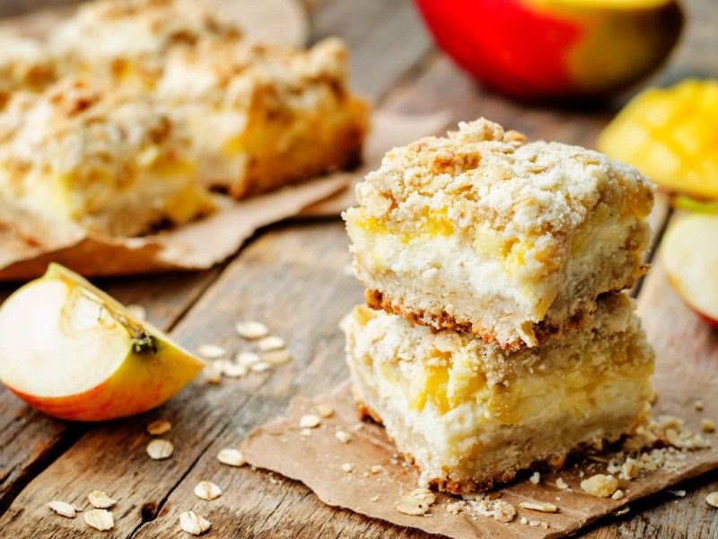Two apple-mango bars on an autumnally decorated table.